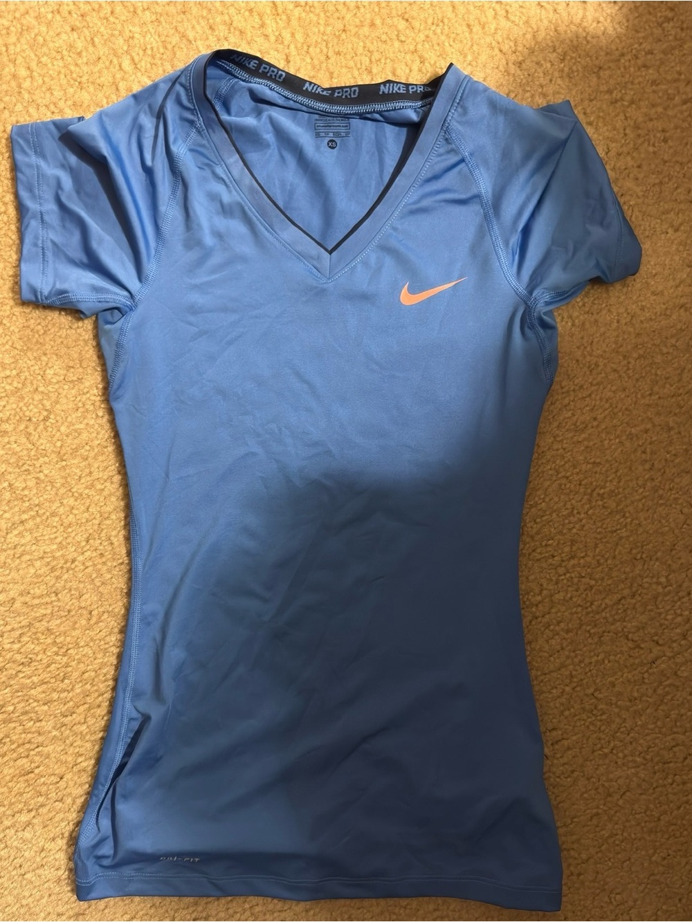 Nike Women's Short Sleeve V-Neck Top in Light Blue with Orange Swoosh